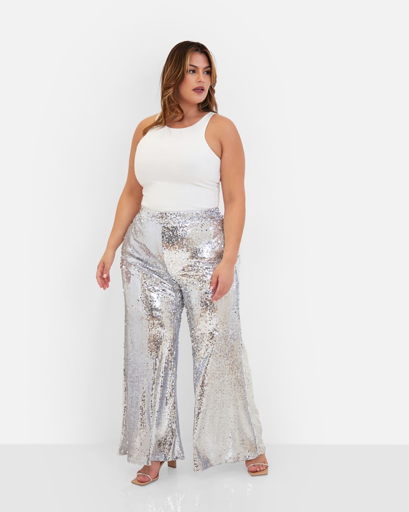 Front of a model wearing a size 1X Lexi Sequin Wide Leg Pants in Silver by Rebdolls. | dia_product_style_image_id:324360
